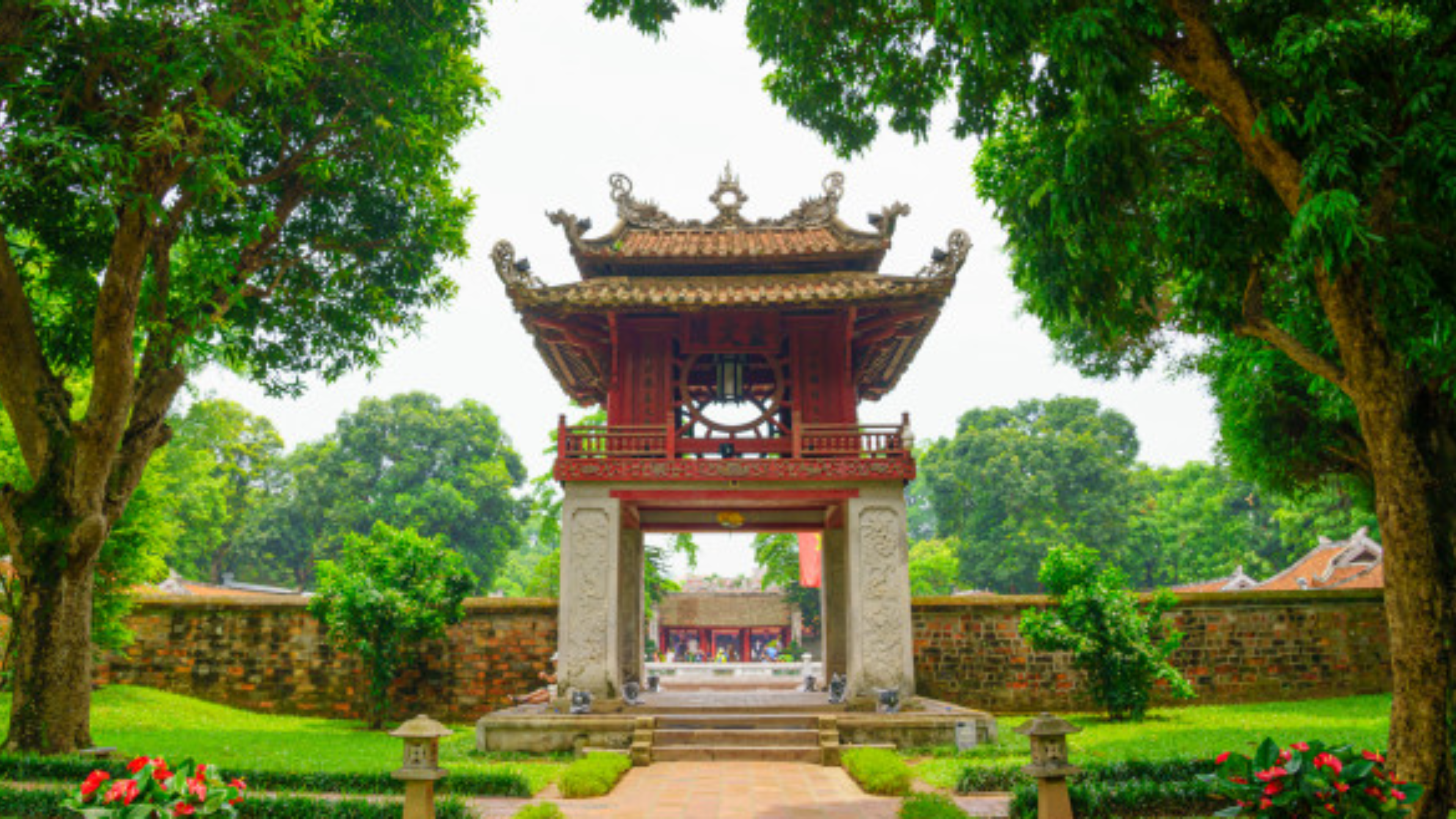 The iconic entrance of the Temple of Literature, a top attraction in Hanoi, offering a peaceful journey through history